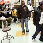 Celebrities Wearing Black Chucks  Rapper Lil Wayne visits the art room at McMain High School to thank the kids for designing an invitation to a party for him.